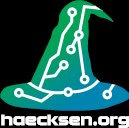 A witches hat colored in a green-blue gradient
                    with a white electronics circuit on it. The text haecksen.org in white is written below.